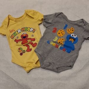 Two Sesame Street onesies/bodysuits